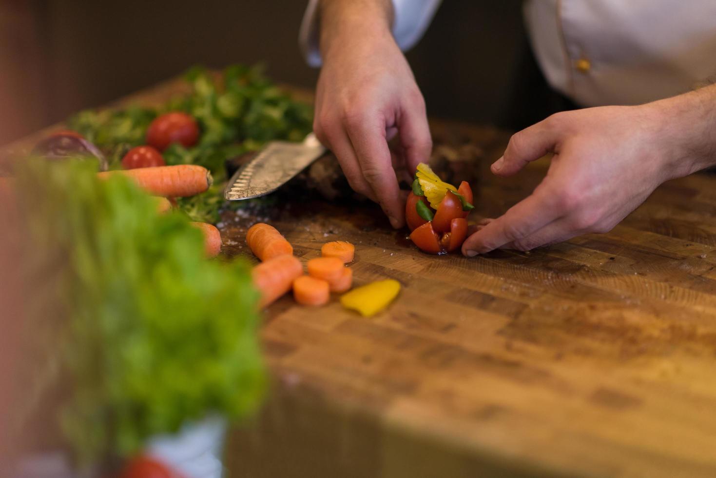 closeup of Chef hands preparing beef steak photo