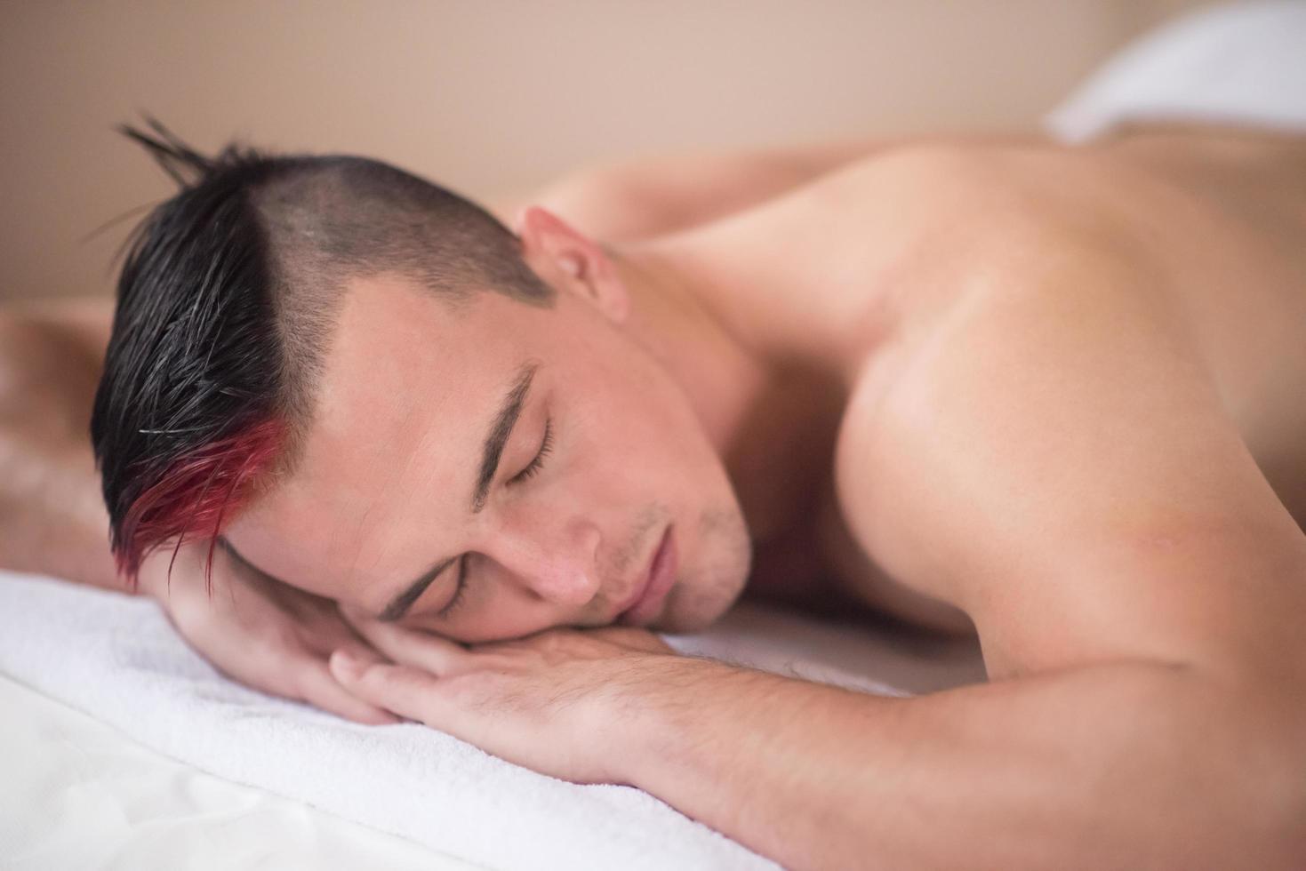 handsome man resting in a spa massage center photo