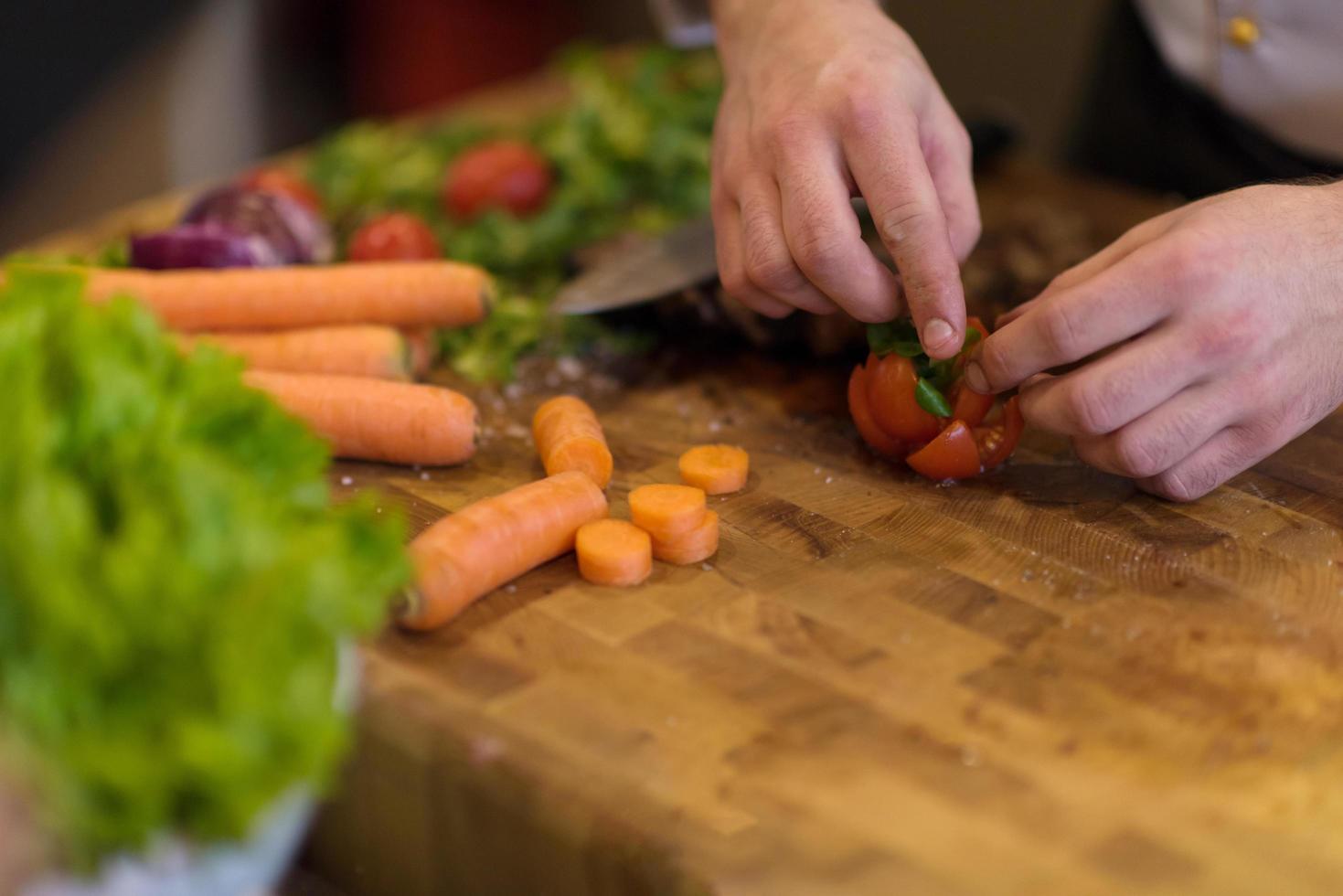 closeup of Chef hands preparing beef steak photo