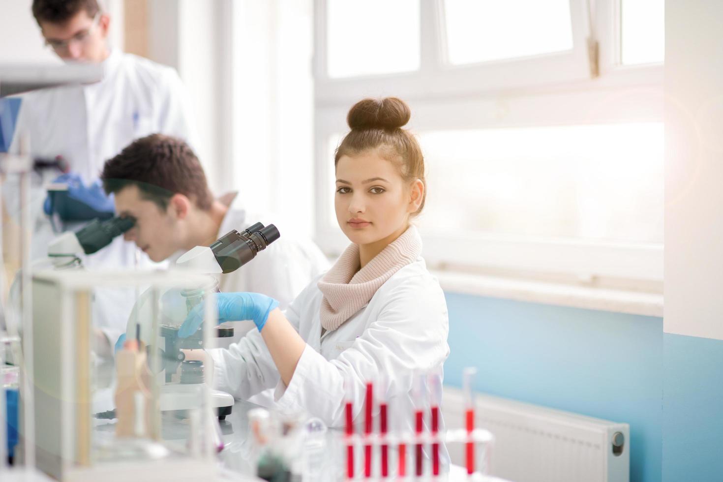 Group of young medical students doing research photo