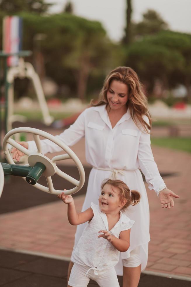 An elderly woman in casual clothes with his daughter spends time together in the park on vacation. Family time. Selective focus photo