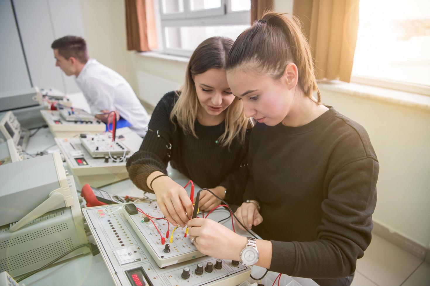 students doing practice in the electronic classroom photo