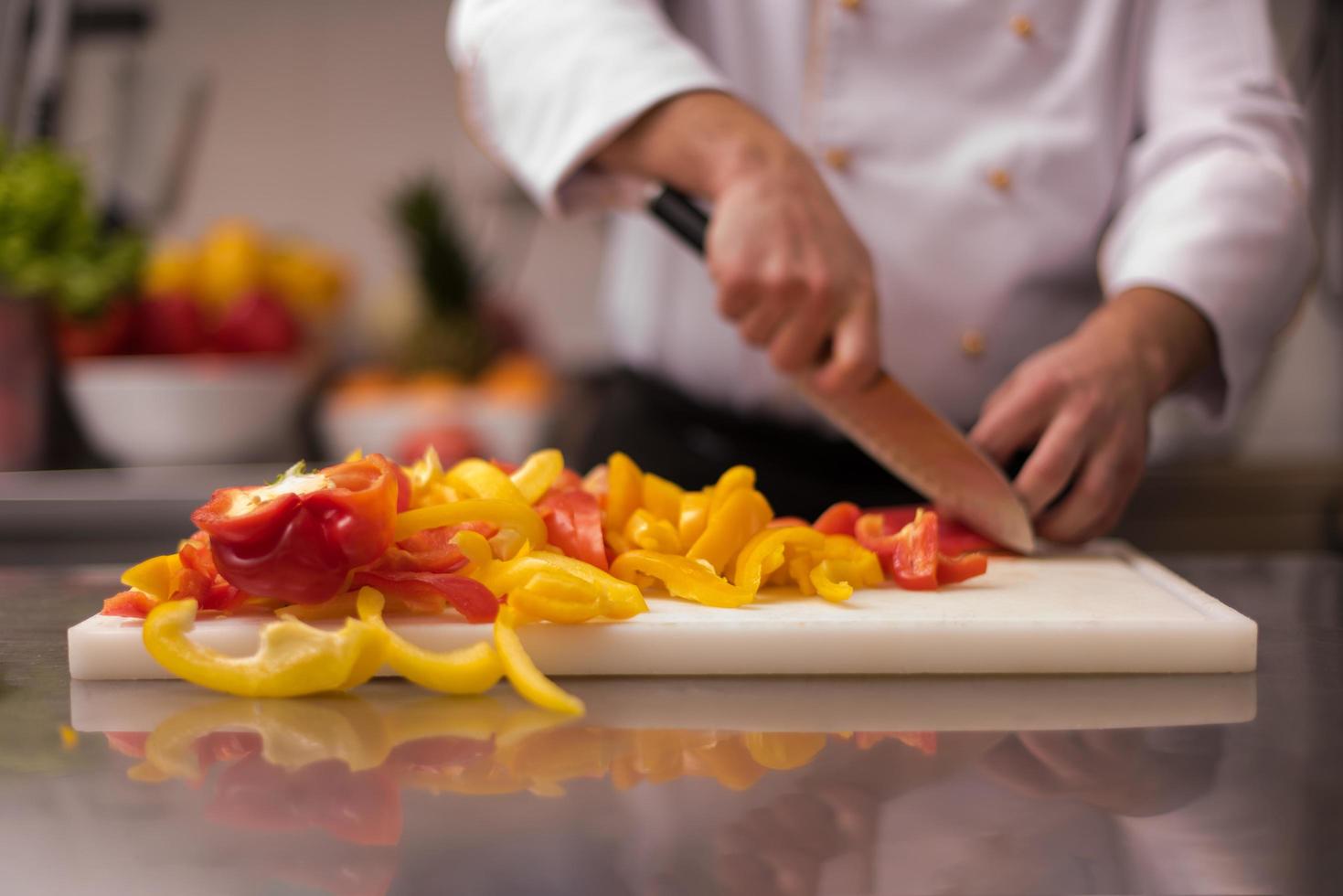 Chef cutting fresh and delicious vegetables photo