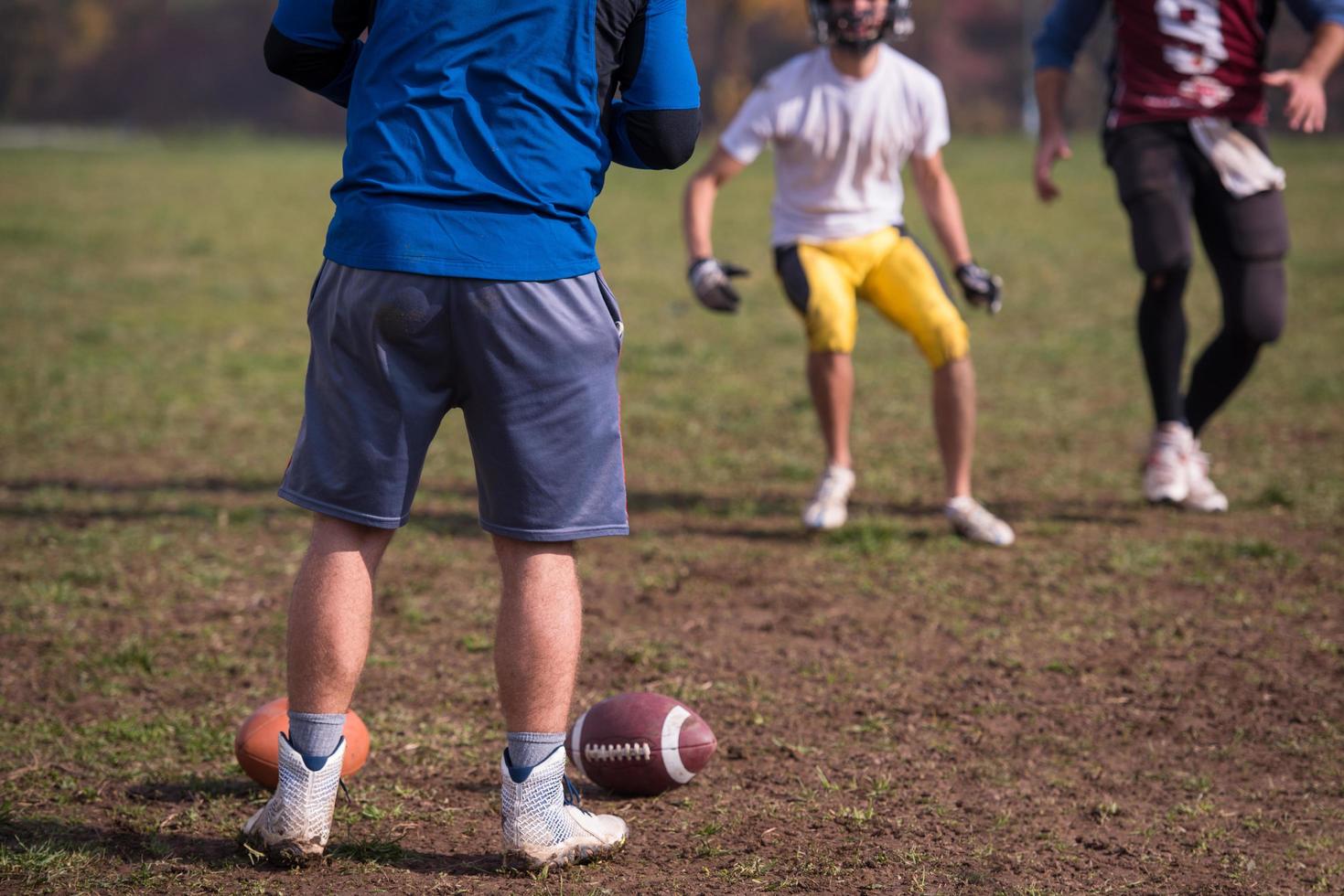 american football team with coach in action photo