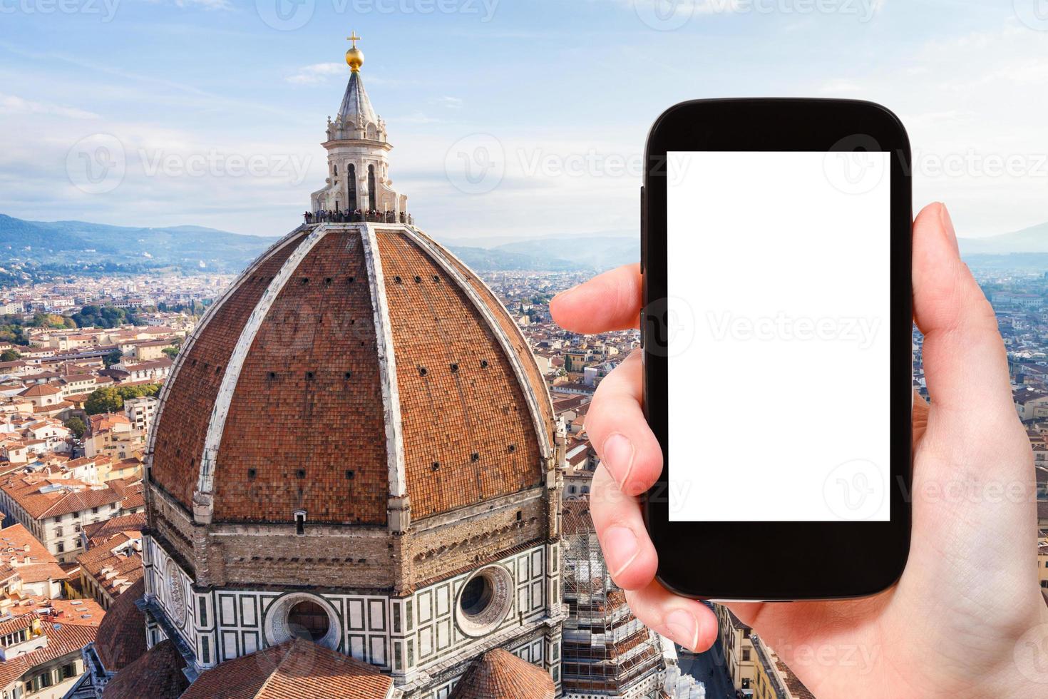tourist photographs Duomo and skyline of Florence photo