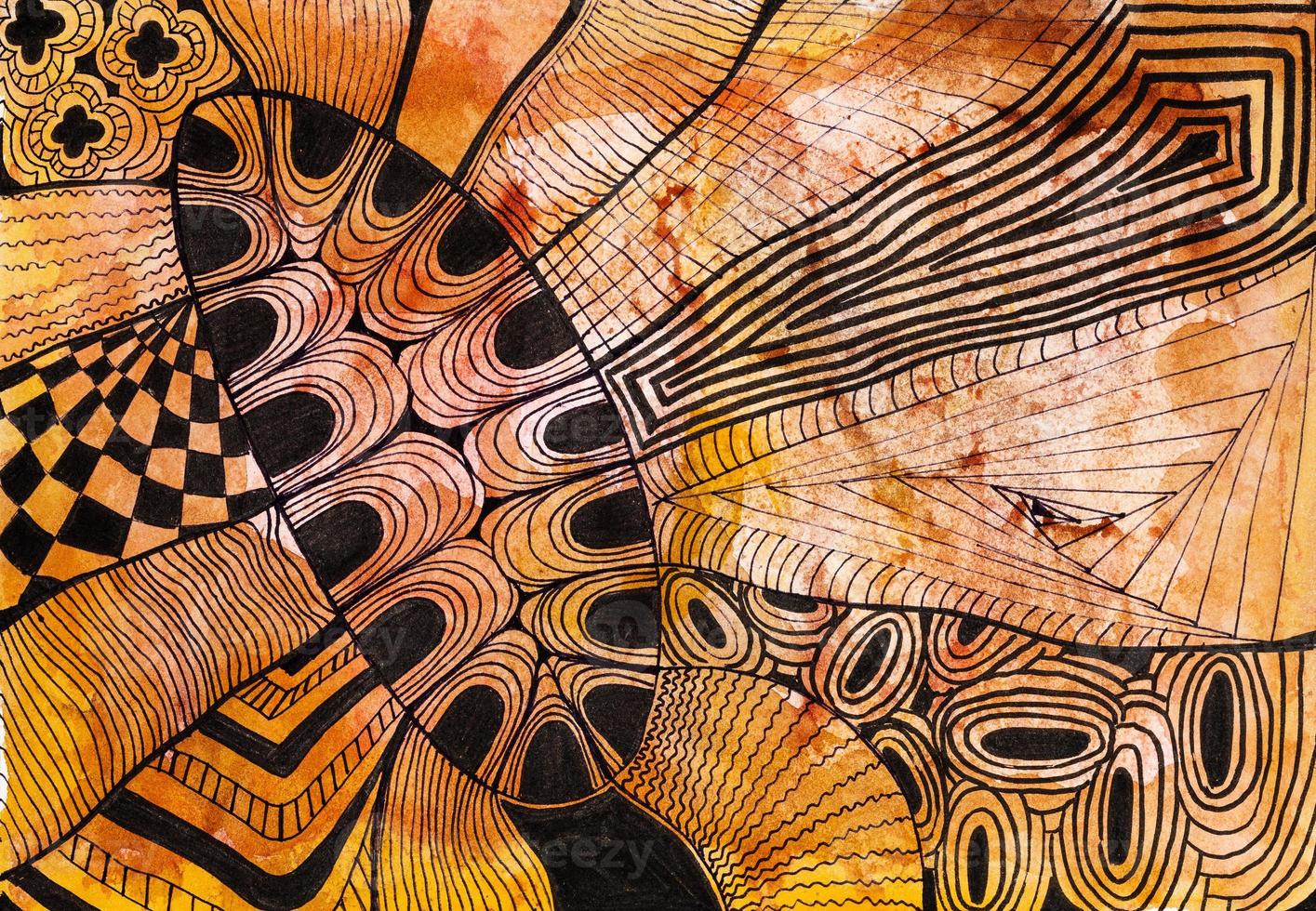 abstract black ornament on brown colored paper photo