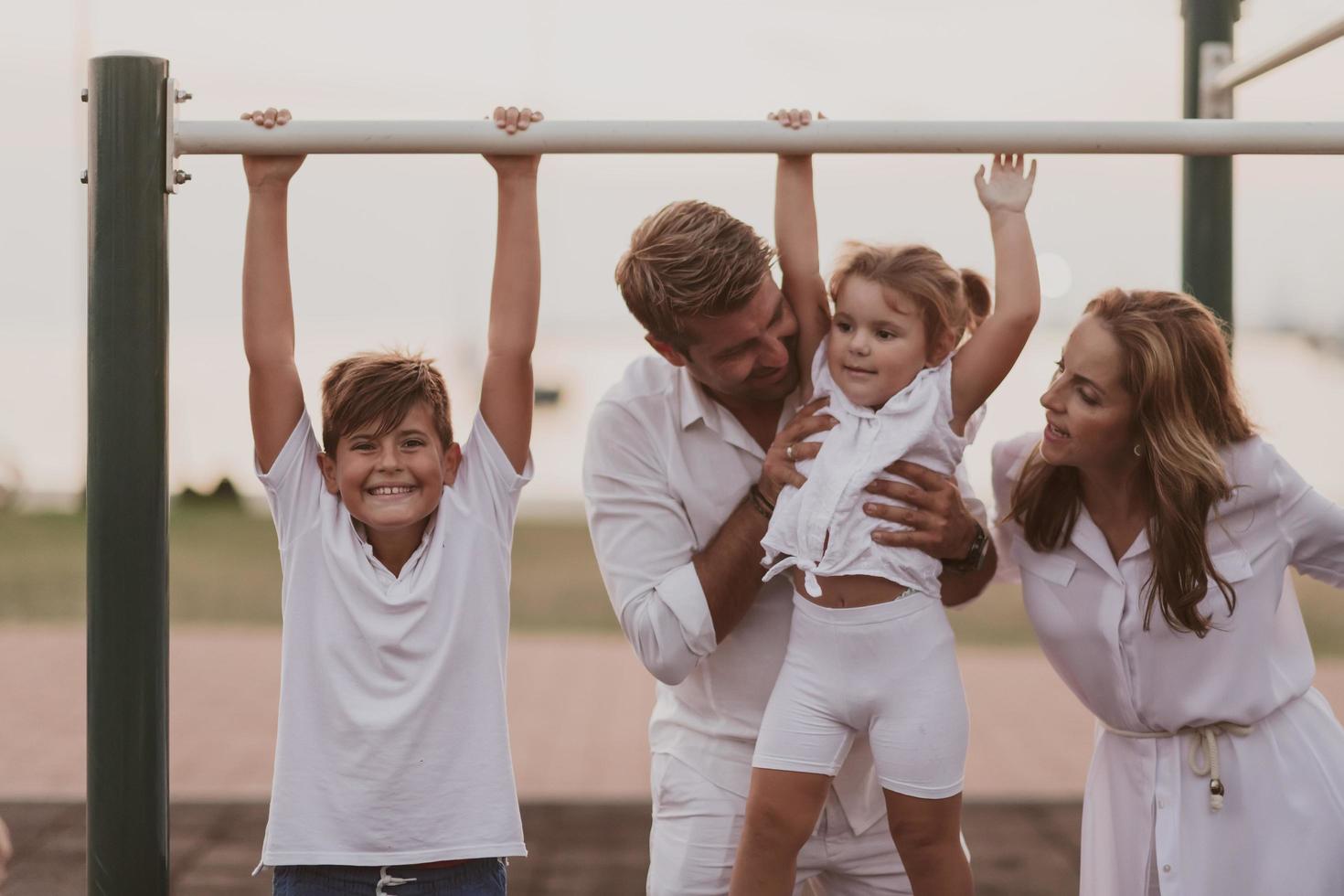 Senior couple in casual clothes with their children spending time in park a vacation together. Family time . Selective focus photo