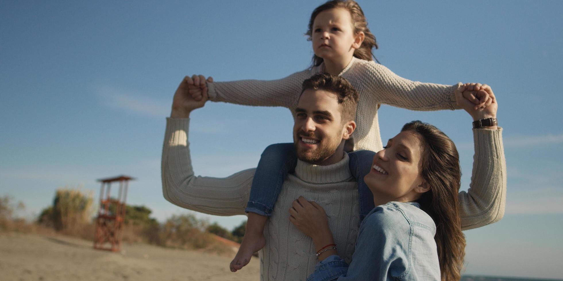 Young family enjoying vecation during autumn photo