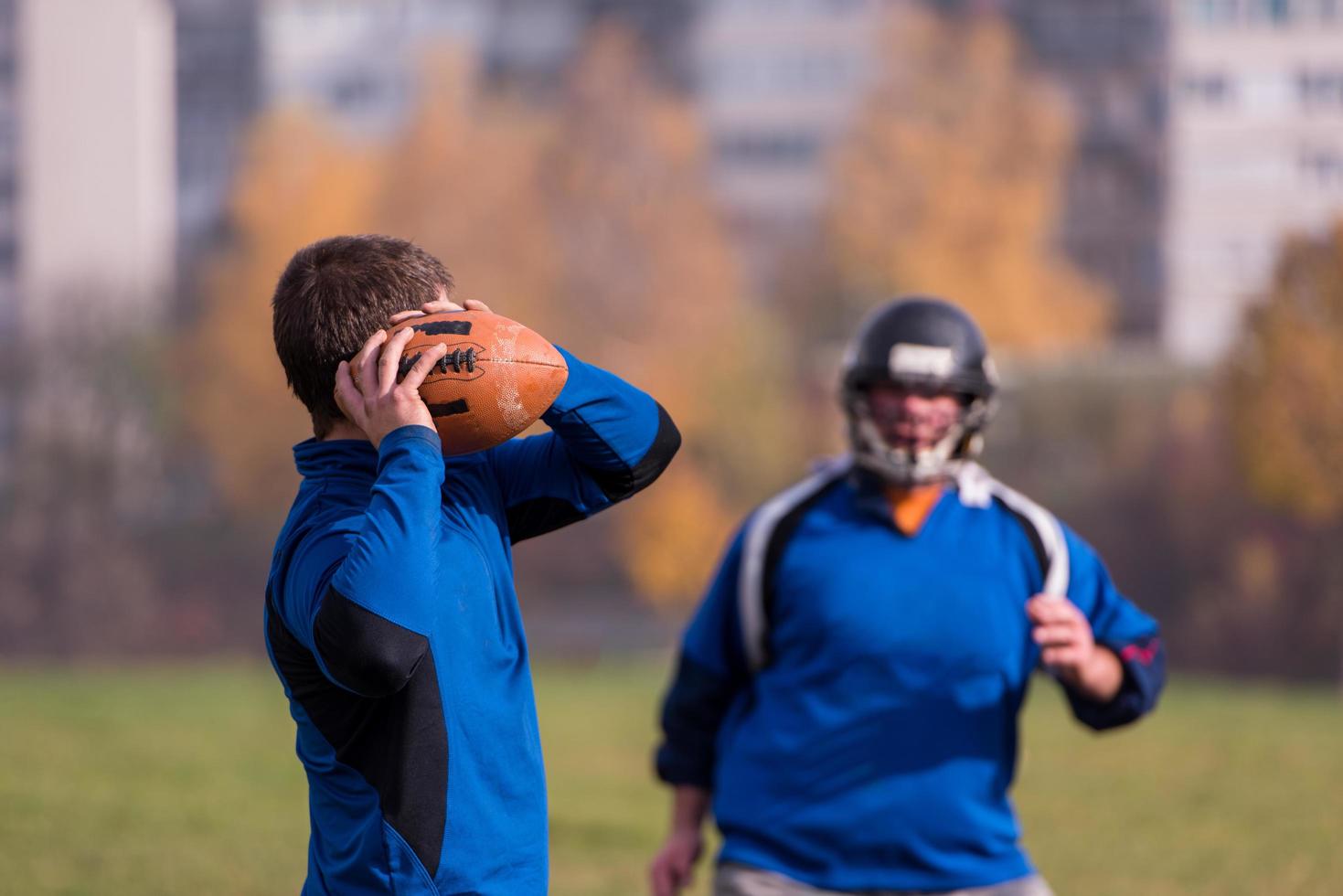 american football team with coach in action photo