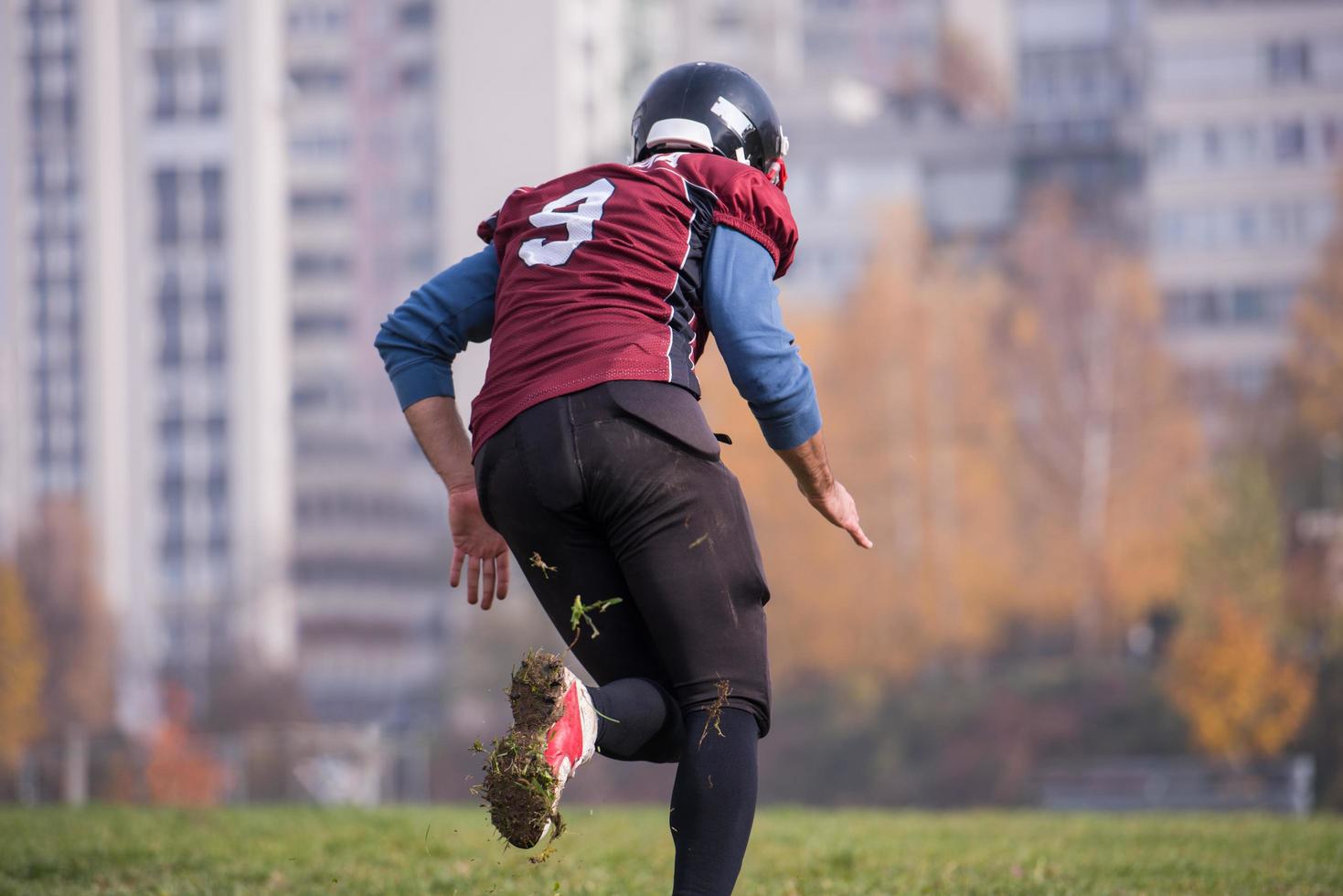 american football player in action photo