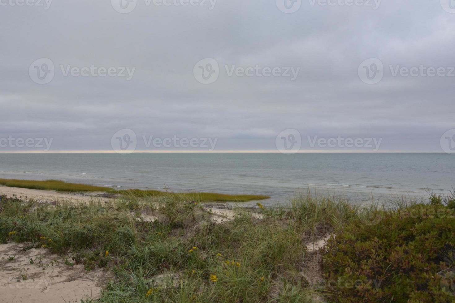 Beautiful landscape on the coast with a cloudy sky photo
