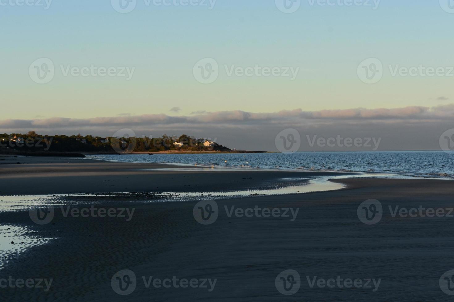 Pretty beach during low tide during a sunset photo