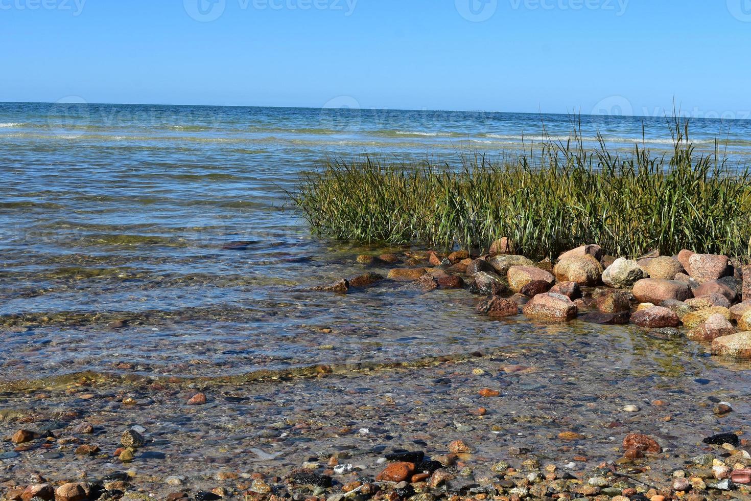 Waves turning into ripples onto the cape cod coast photo