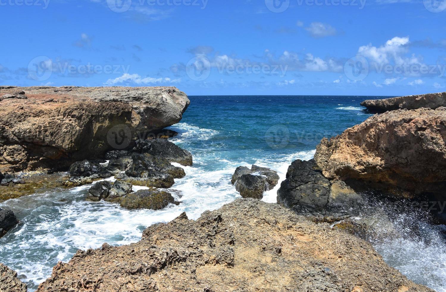Waves Crashing Along the Coast of Aruba photo