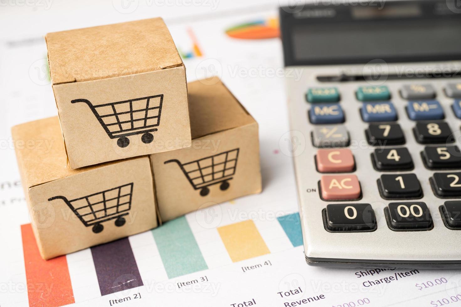 Shopping cart logo on box with magnifying glass on graph background. Banking Account, Investment Analytic research data economy, trading, Business import export transportation online company concept. photo