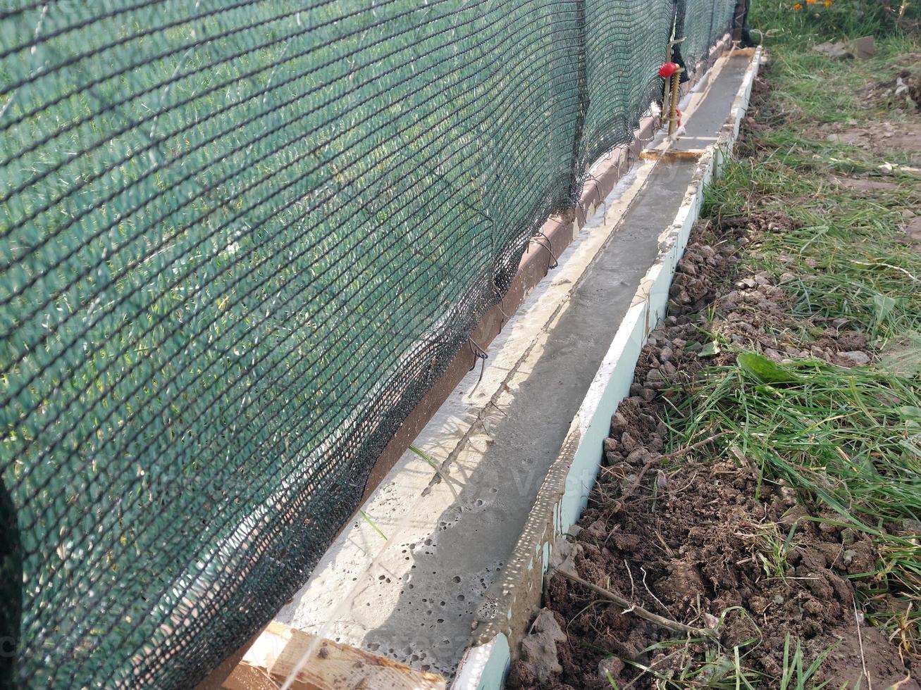 Construction of a strip foundation for a fence photo