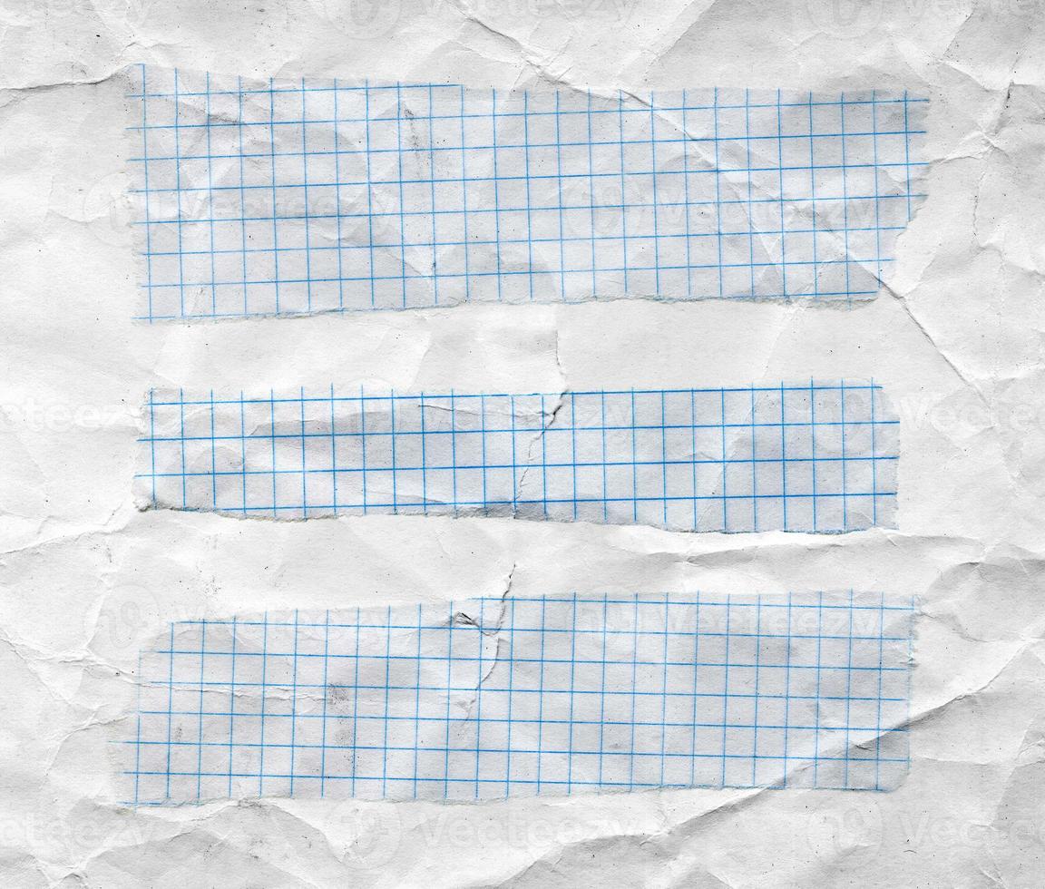 Math torn papers isolated on wrinkled white paper sheet photo