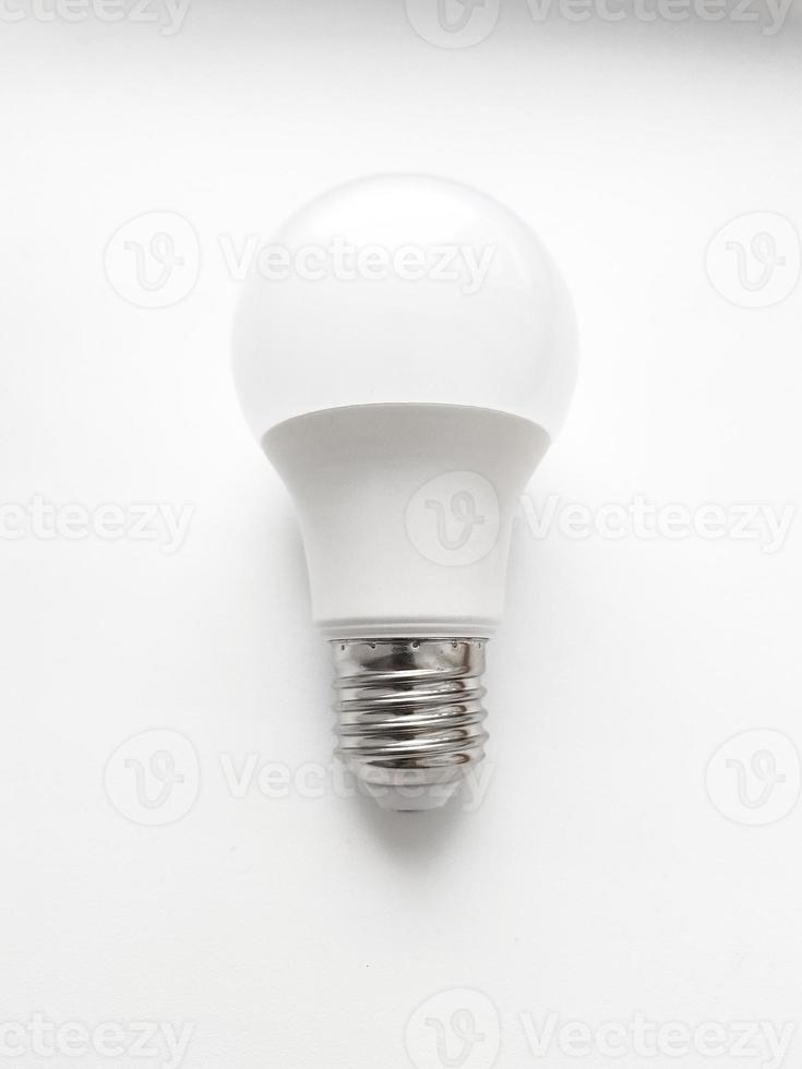 LED white light bulb isolated on white background. Energy saving bulb photo