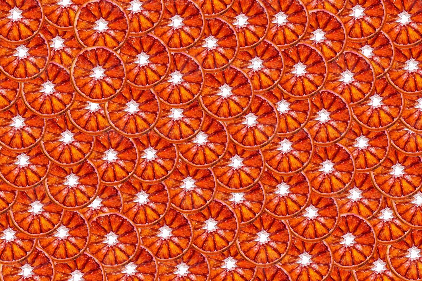 Red blood orange slices background. Cut citrus fruit. photo