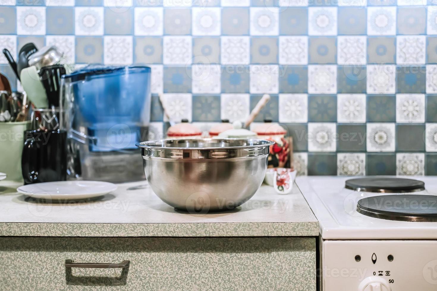 Utensils are on kitchen table. Kitchen close-up. Authentic real environment. photo