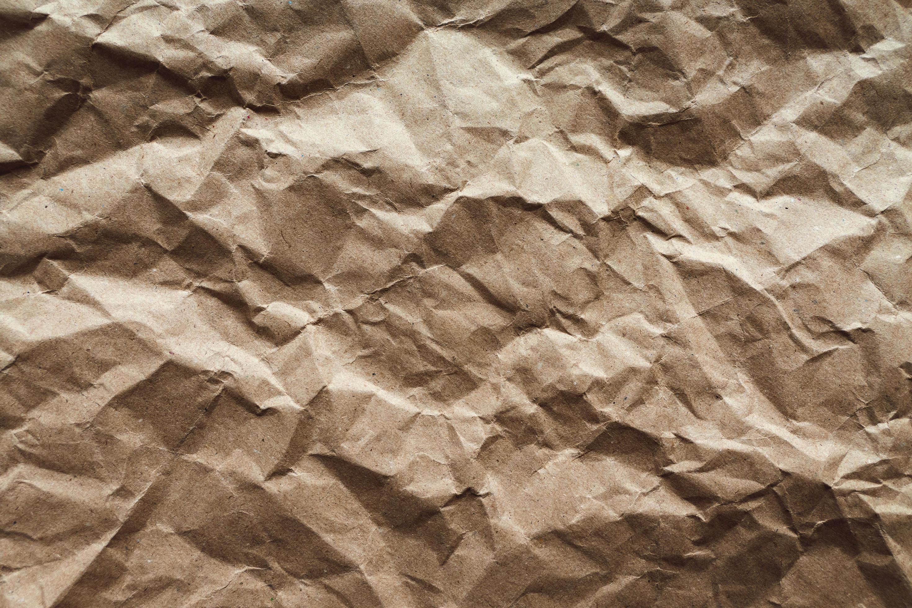 Crumpled paper texture, brown recycled paper abstract background 12707795  Stock Photo at Vecteezy