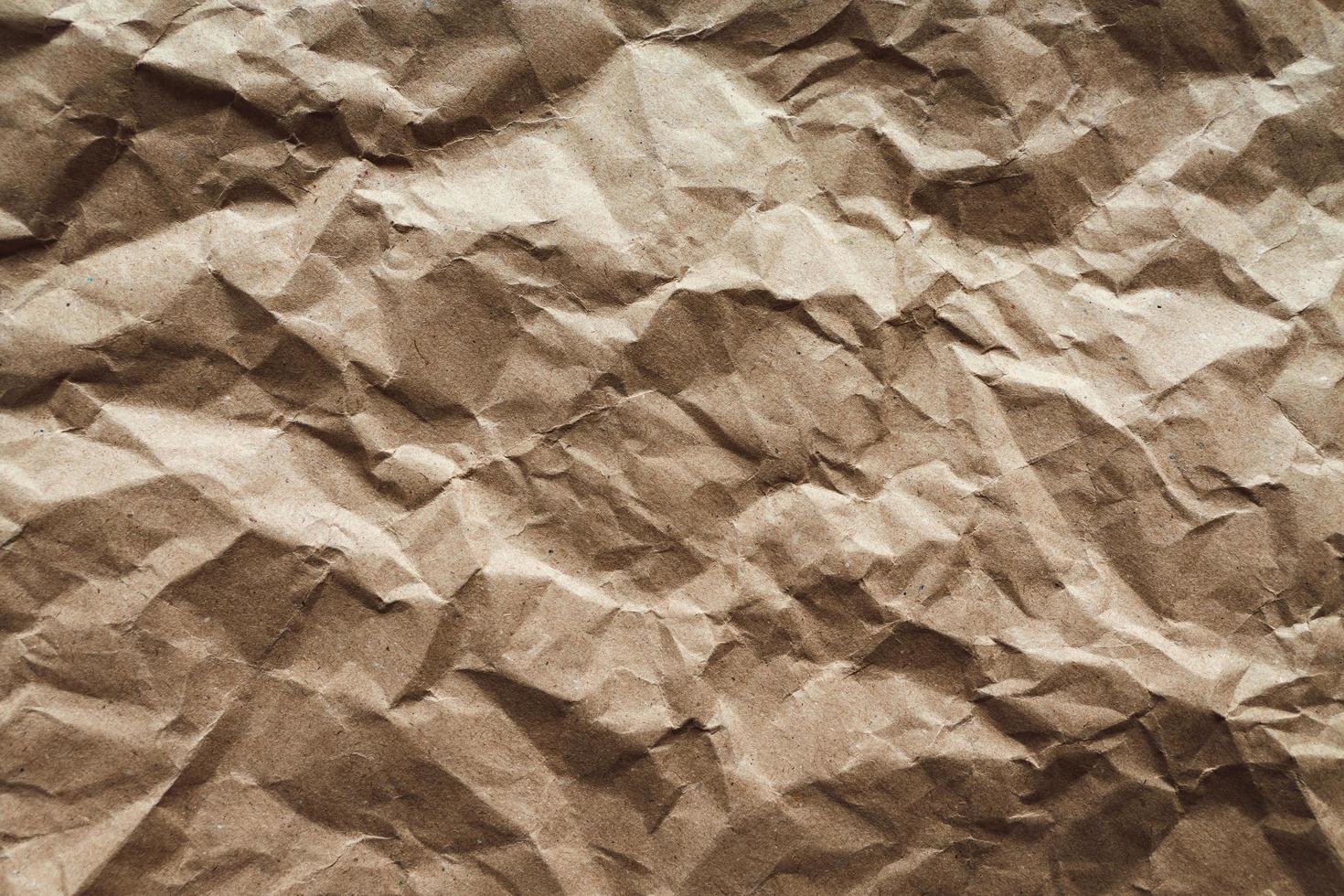 Crumpled paper texture, brown recycled paper abstract background