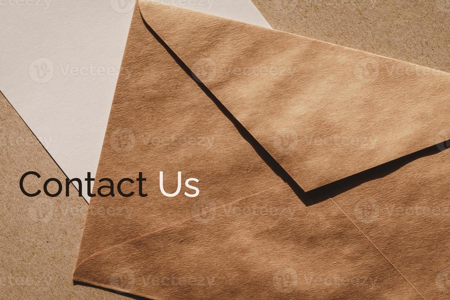 Contact us banner for customer support web page, brown envelope and white paper note photo