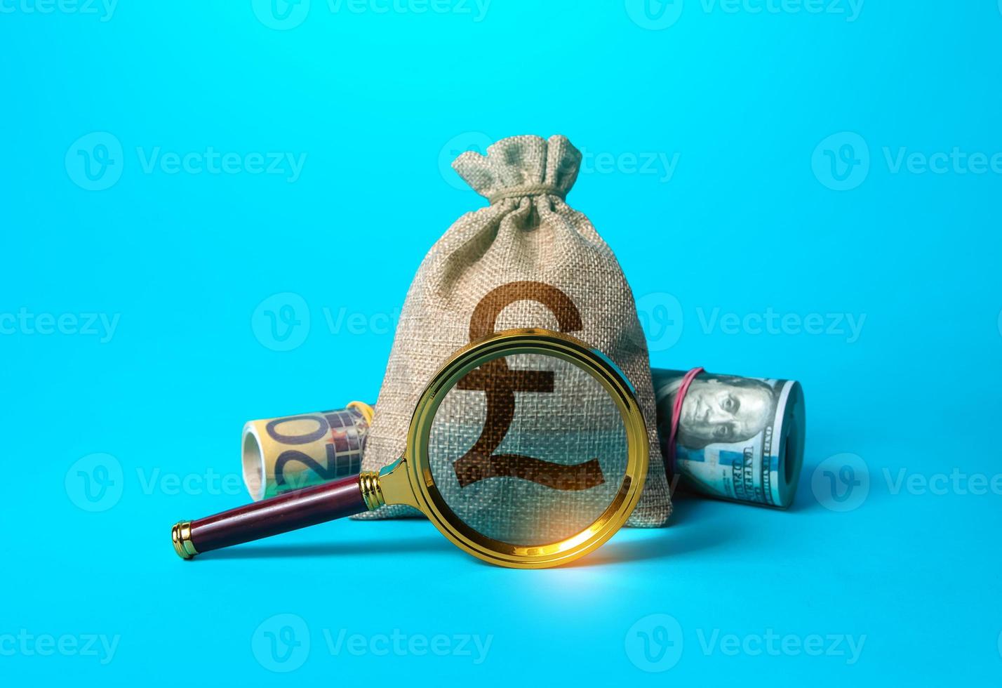 British pound sterling money bag and magnifying glass. Anti money 