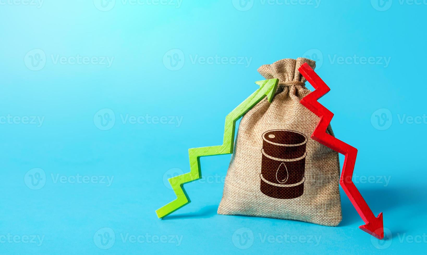 Bag with oil barrel and up down arrows. Energy crisis. Unstable power-generating and fuel prices. Chemical and transport industries. Speculation on stock exchange. Imbalance global supply and demand. photo