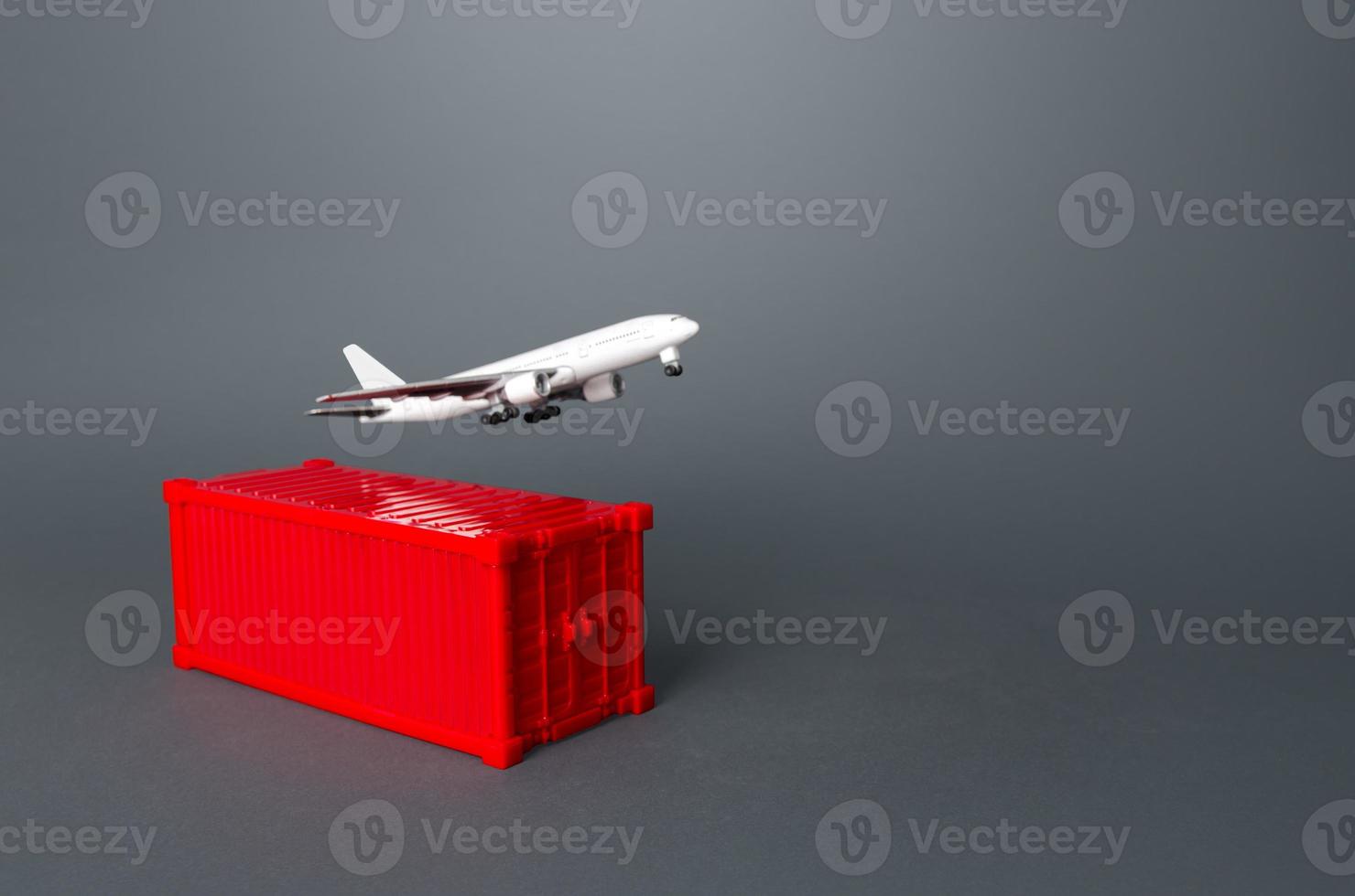 Cargo plane over red ship container. Services of express delivery and transportation of goods by plane. World trade and logistics. Business and commerce, import and export of products. Air freight photo