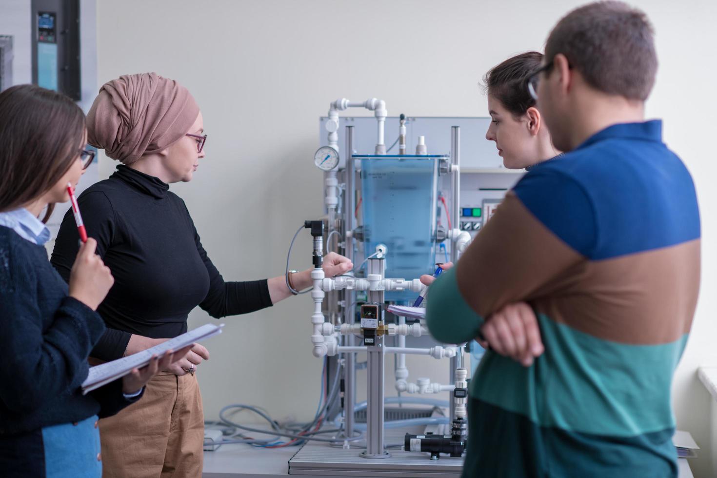 young students doing practice in the electronic classroom photo