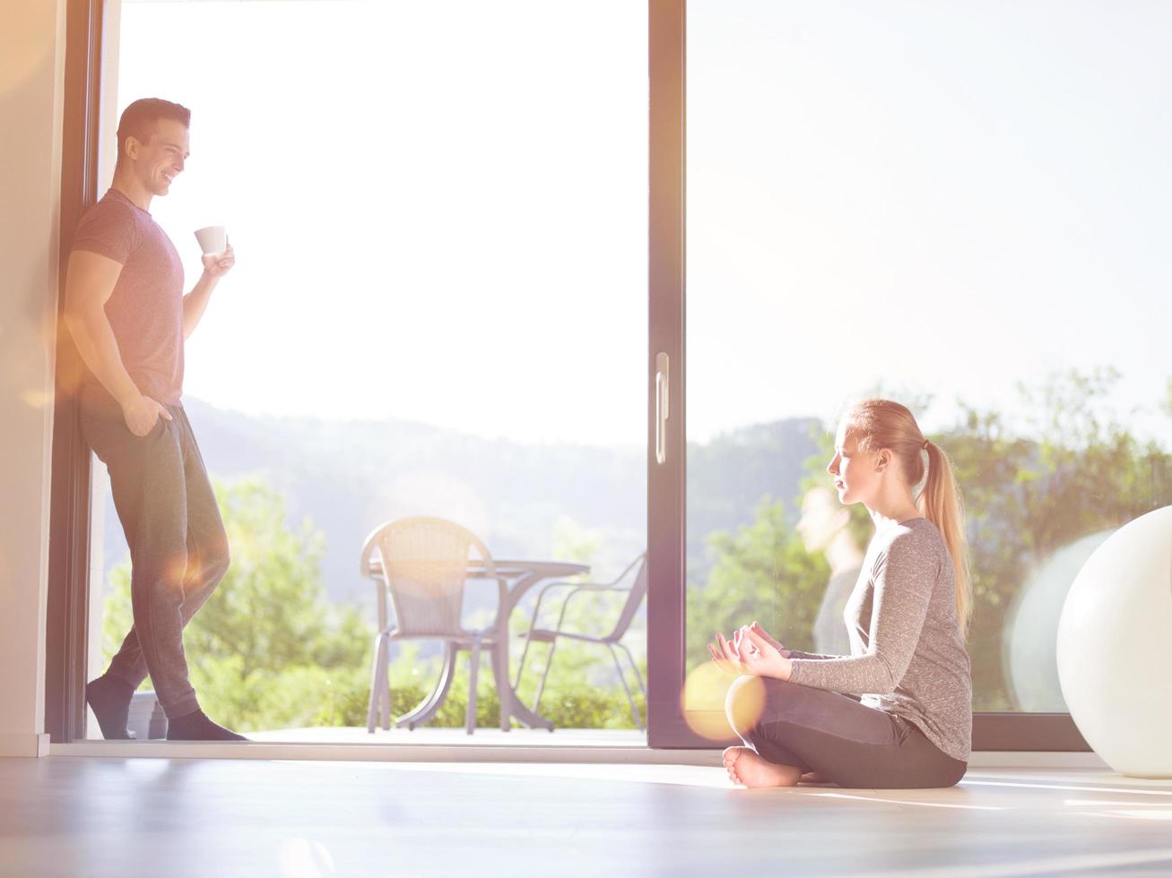 couple on the door of their luxury home photo