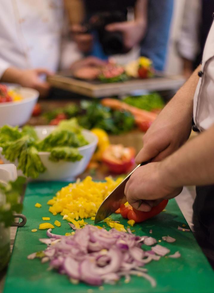 Chef cutting fresh and delicious vegetables photo