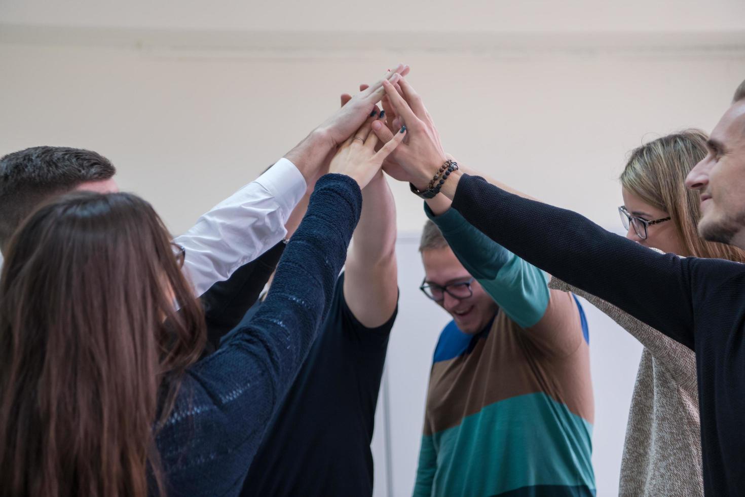 students celebrating successfully finished project photo