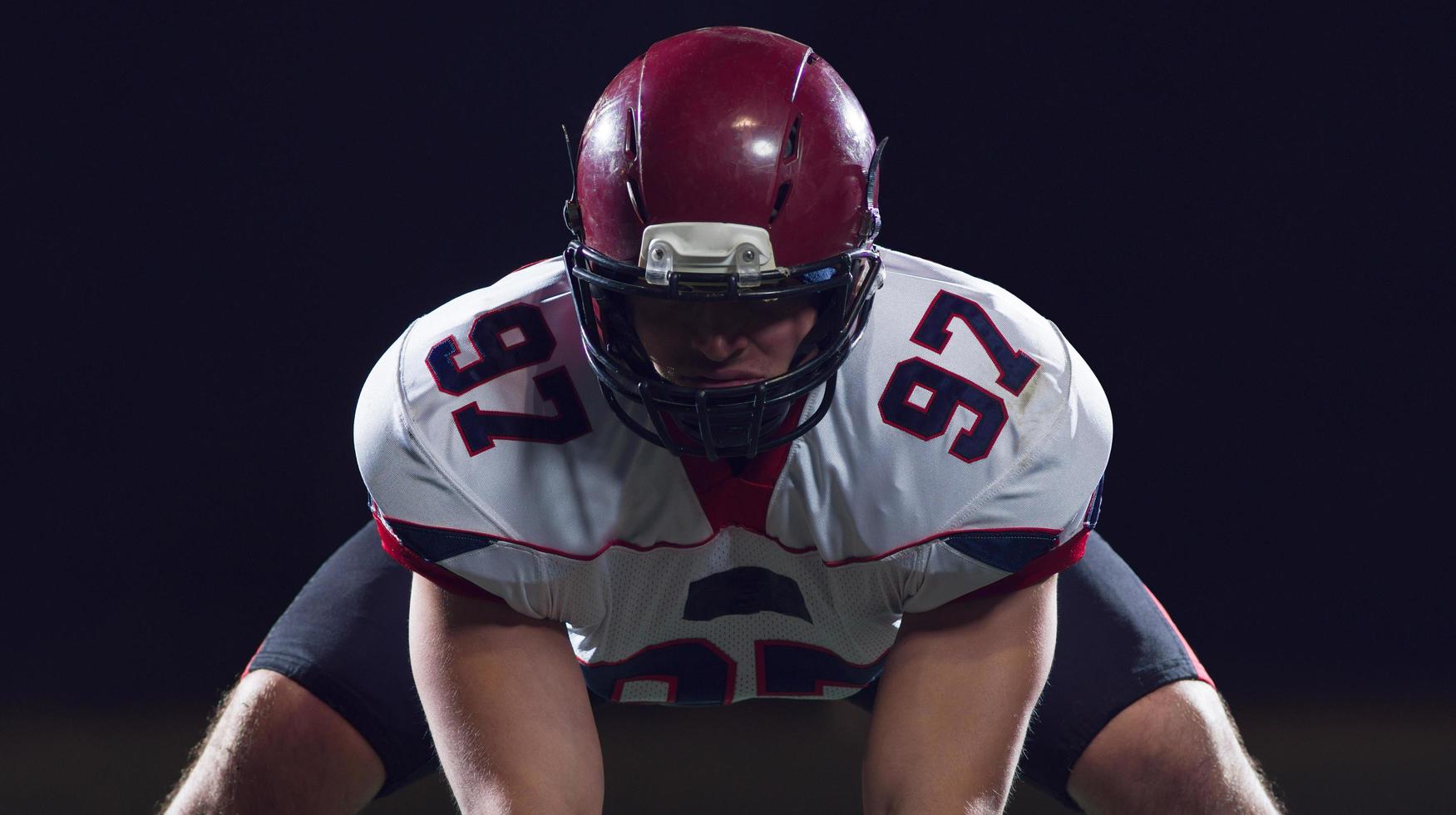 American football player starting football game photo