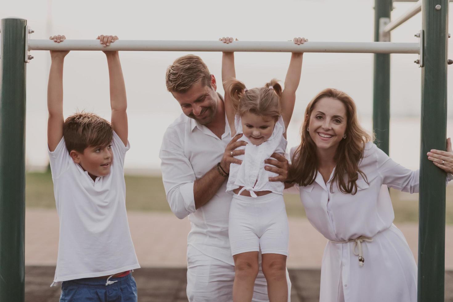 Senior couple in casual clothes with their children spending time in park a vacation together. Family time . Selective focus photo