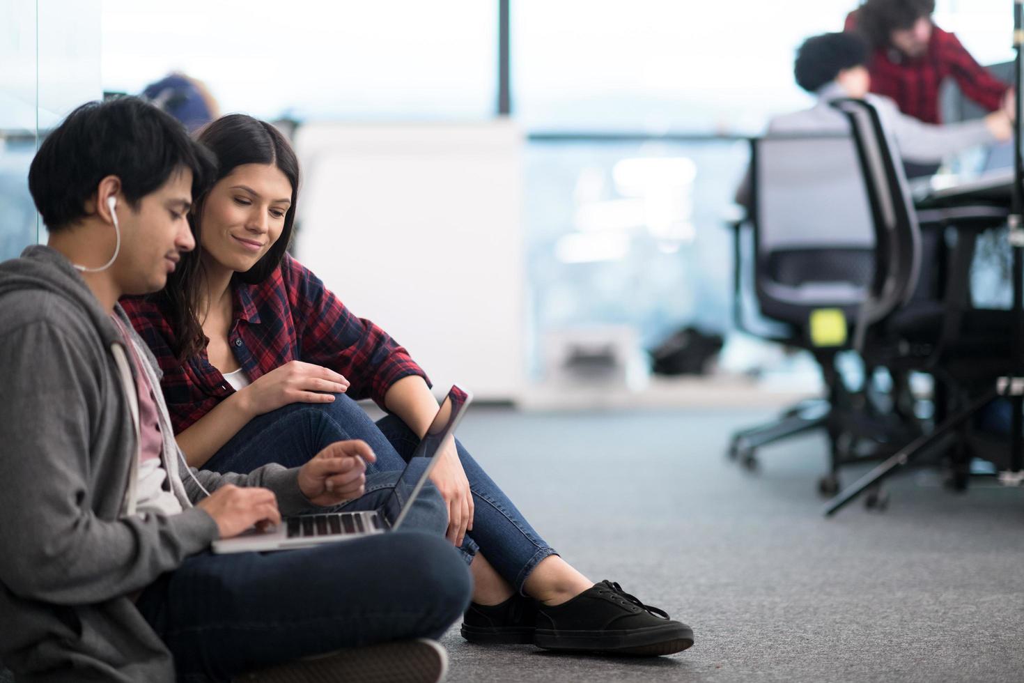 software developers couple working on the floor photo