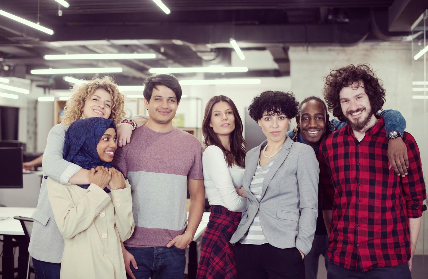 portrait of young excited multiethnics business team photo