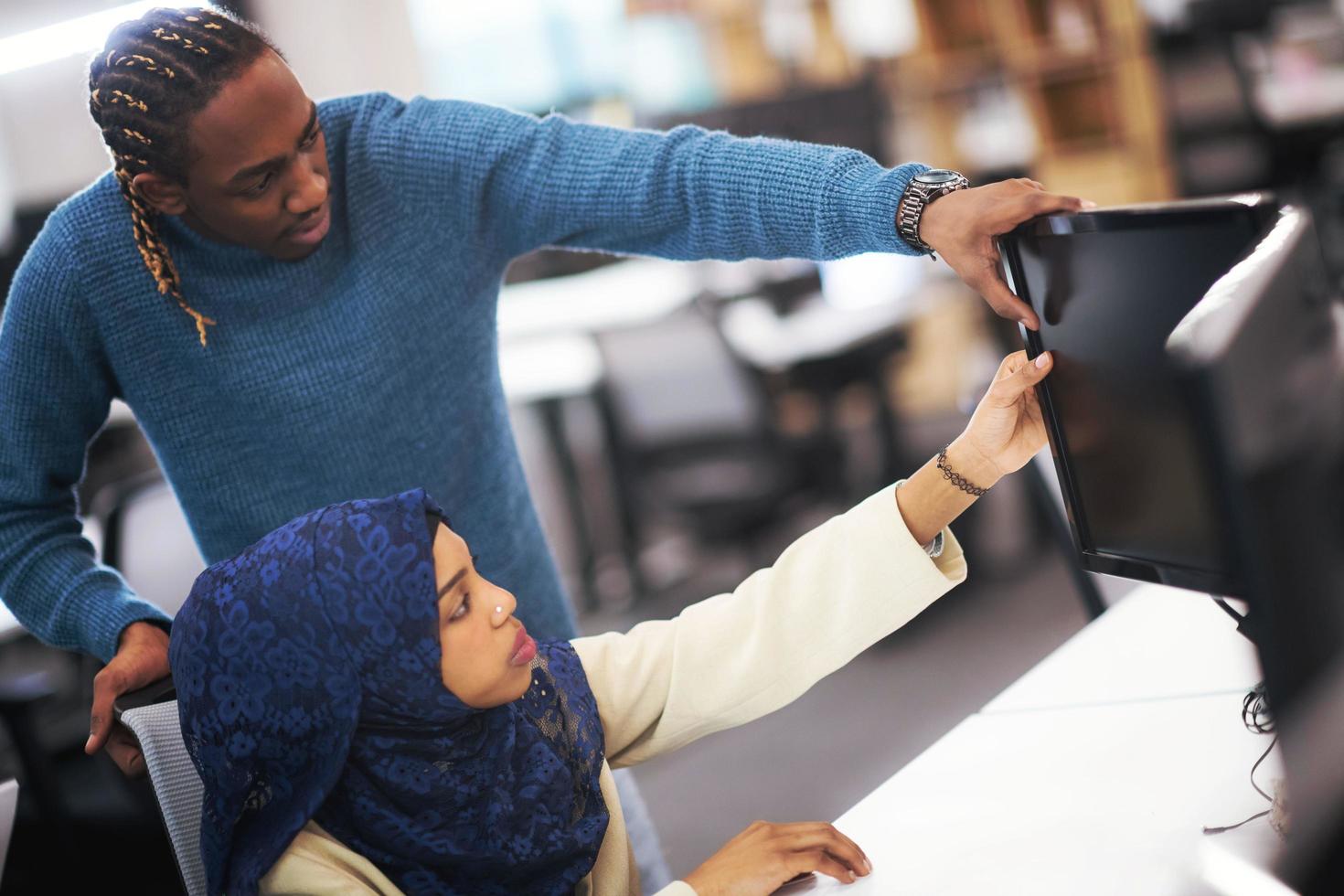 young black muslim female software developer at work photo