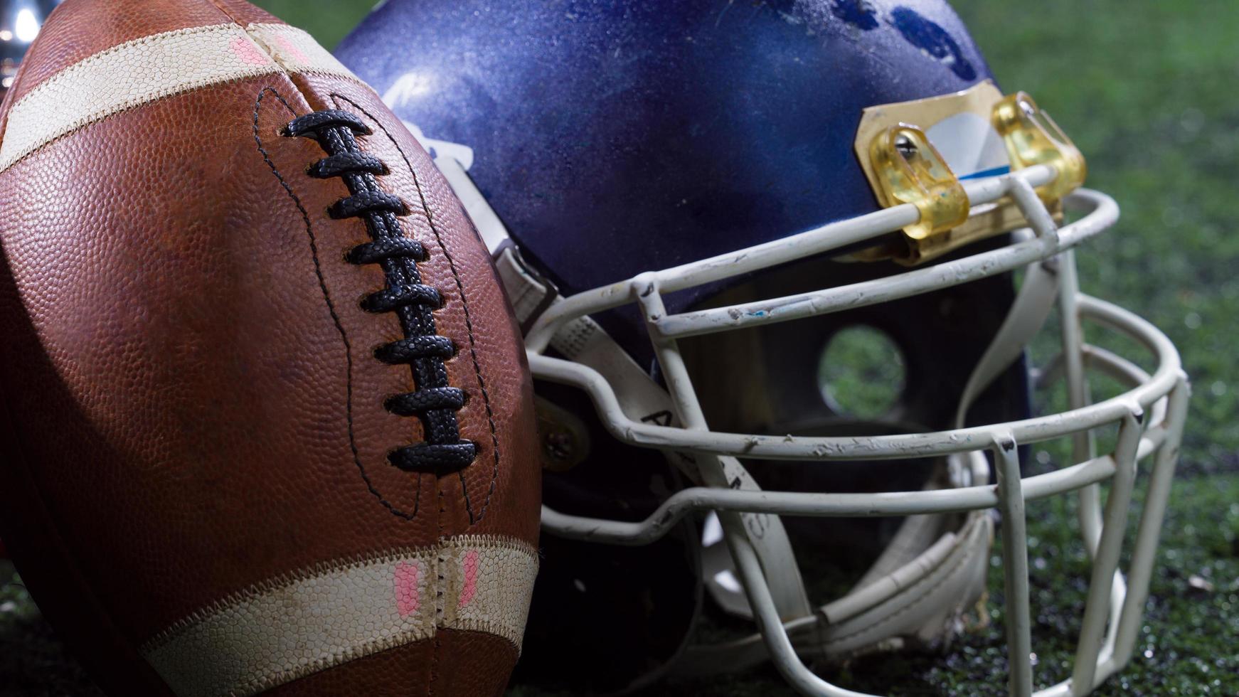 closeup of american football,helmets and trophy photo