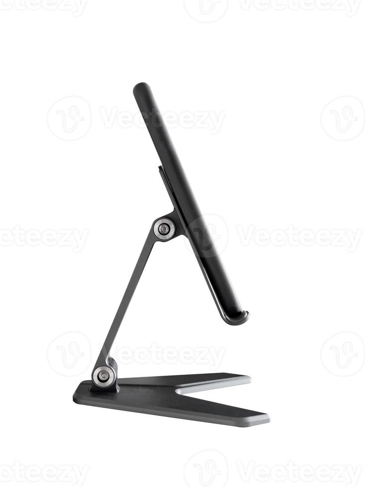 Smartphone stand on mobile holder isolated on white. photo