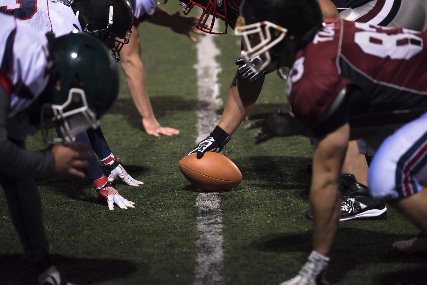 american football players are ready to start photo