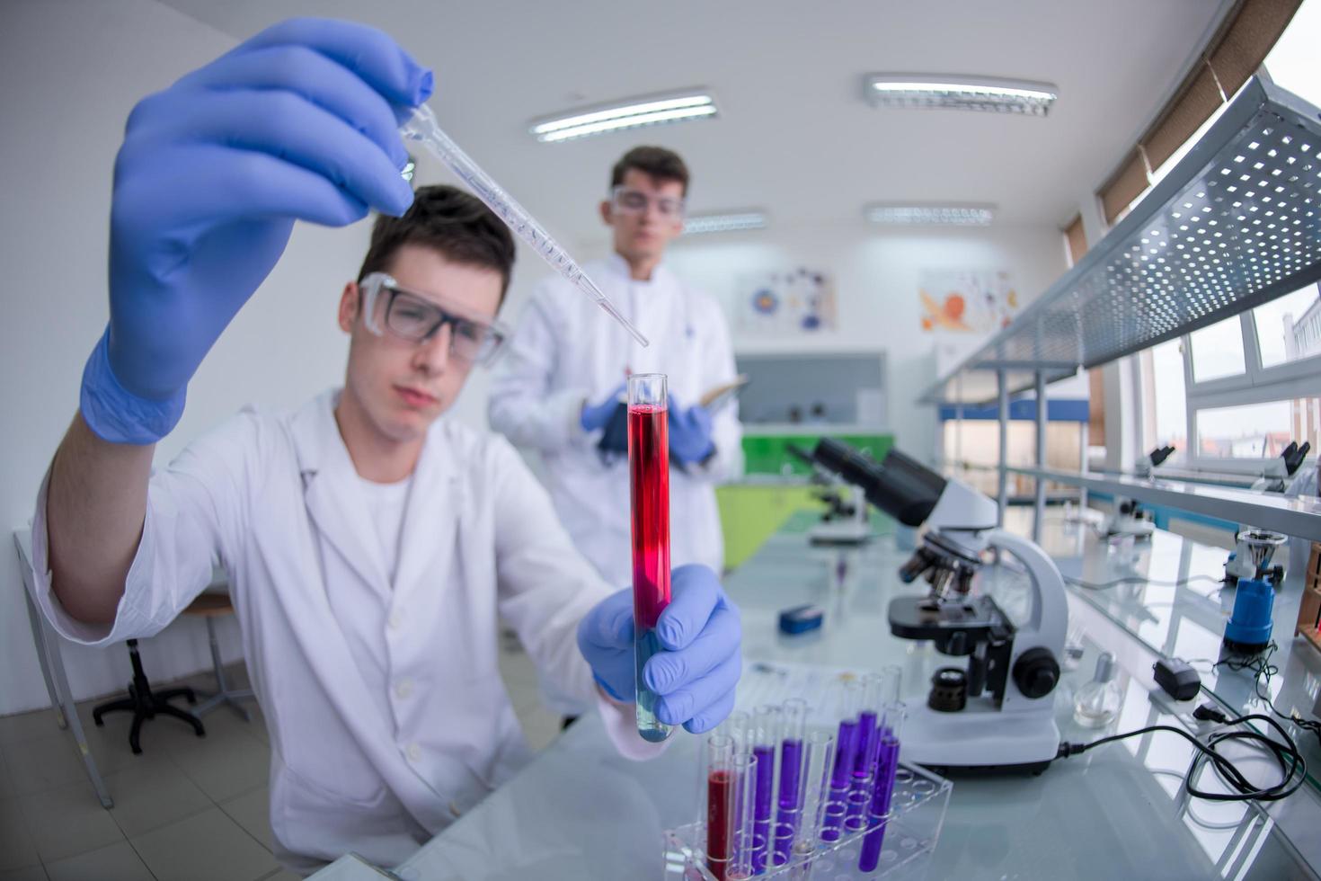 Group of young medical students doing research photo