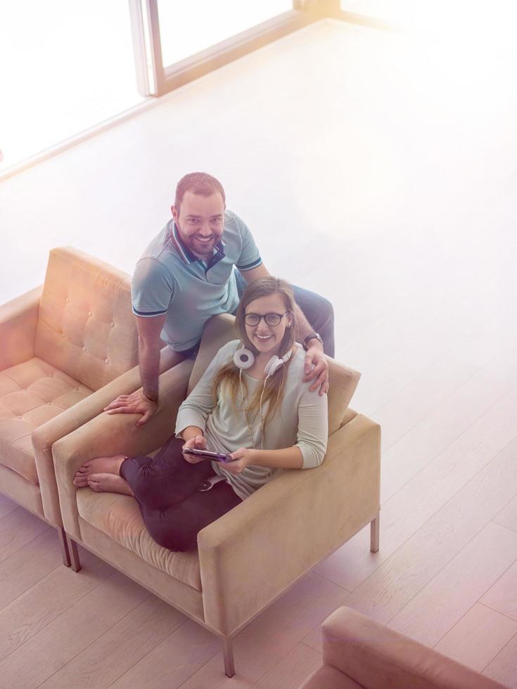 couple relaxing at  home with tablet computers photo