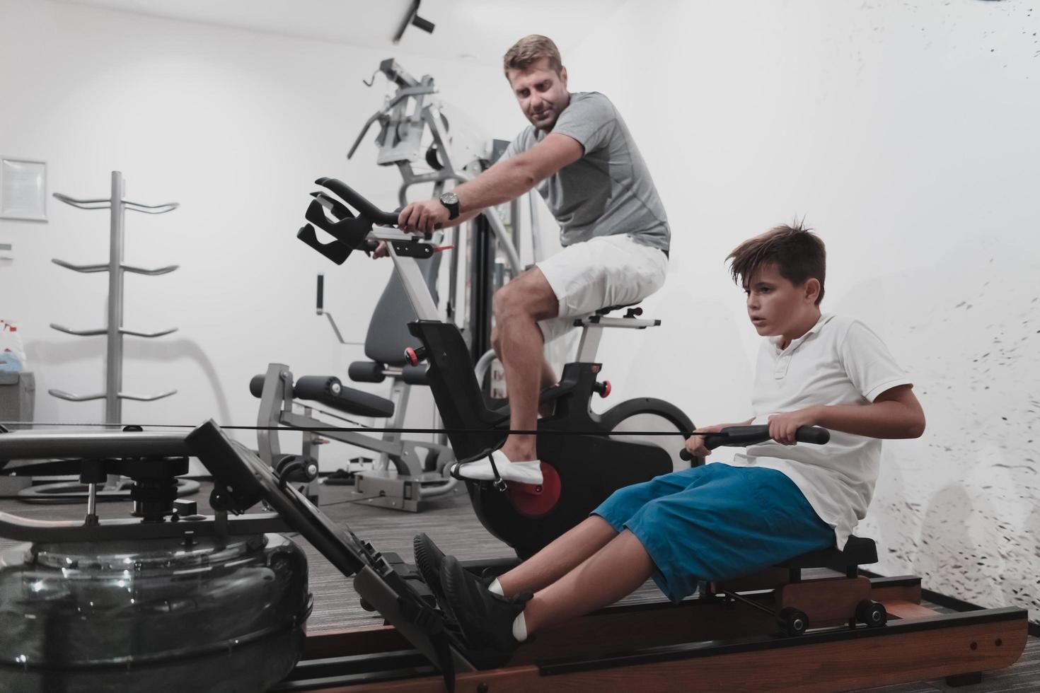 Father and son train together at home gym. The concept of healthy life. Selective focus photo