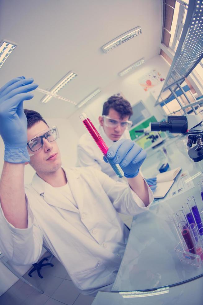 Group of young medical students doing research photo