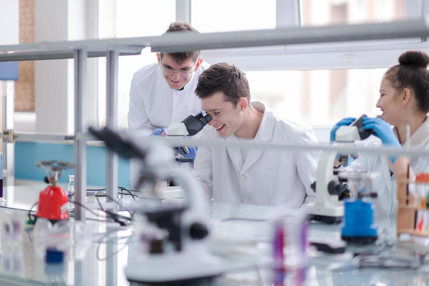 Group of young medical students doing research photo