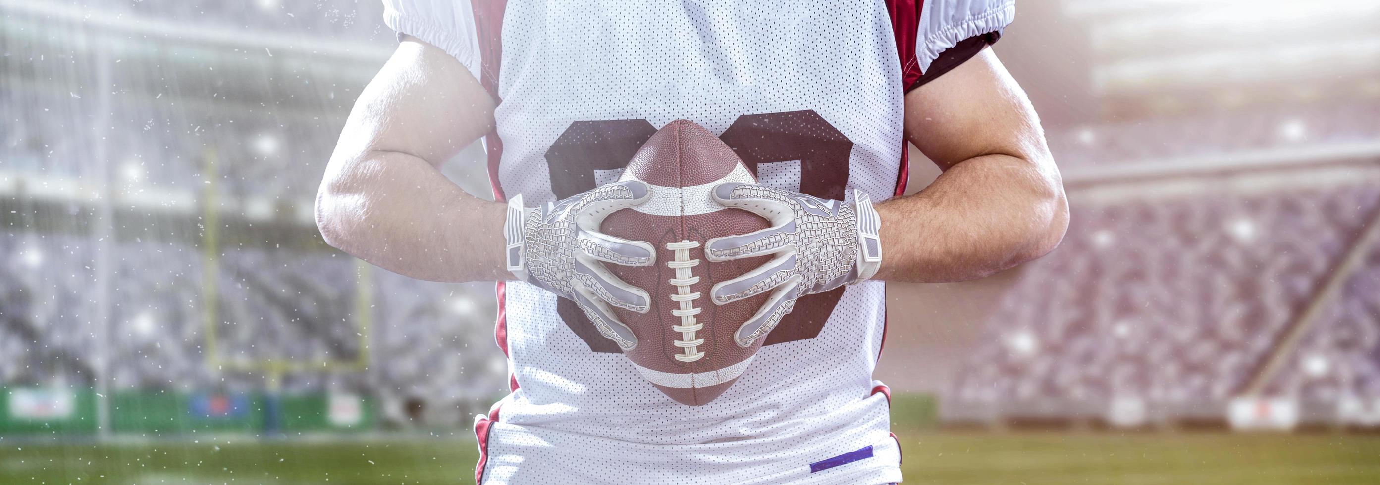 closeup American Football Player isolated on big modern stadium photo