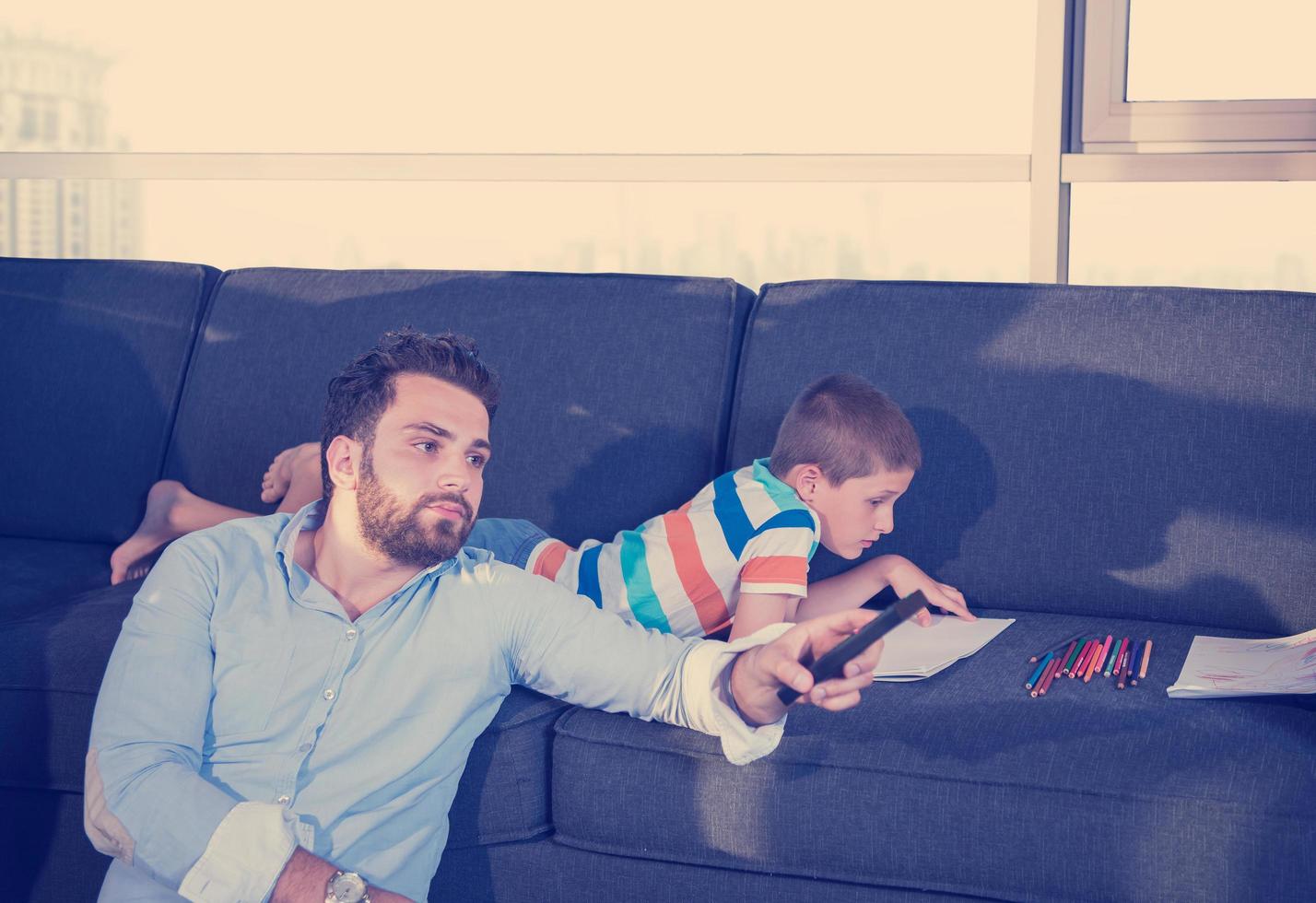 Happy Young Family Playing Together on sofa photo