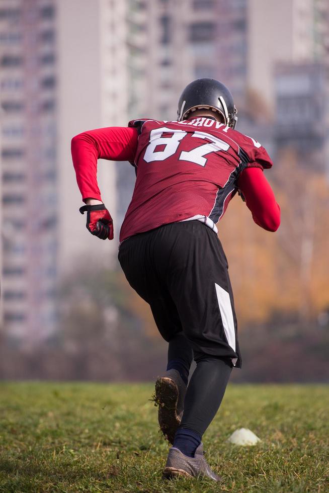 american football player in action photo